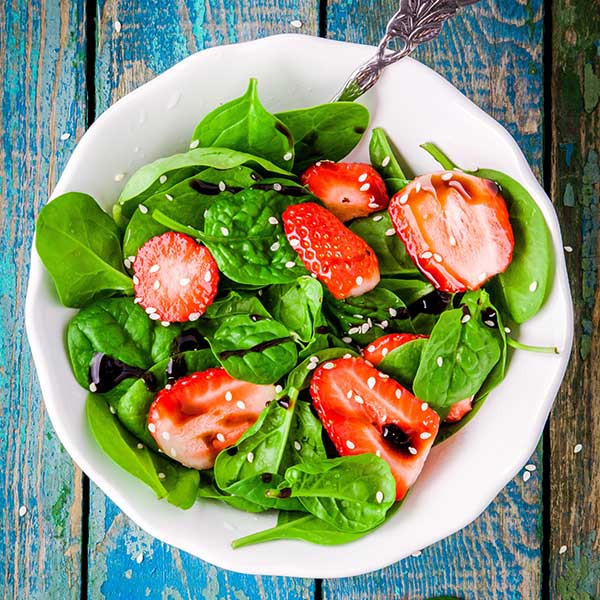 Healthy and delicious salad with strawberries